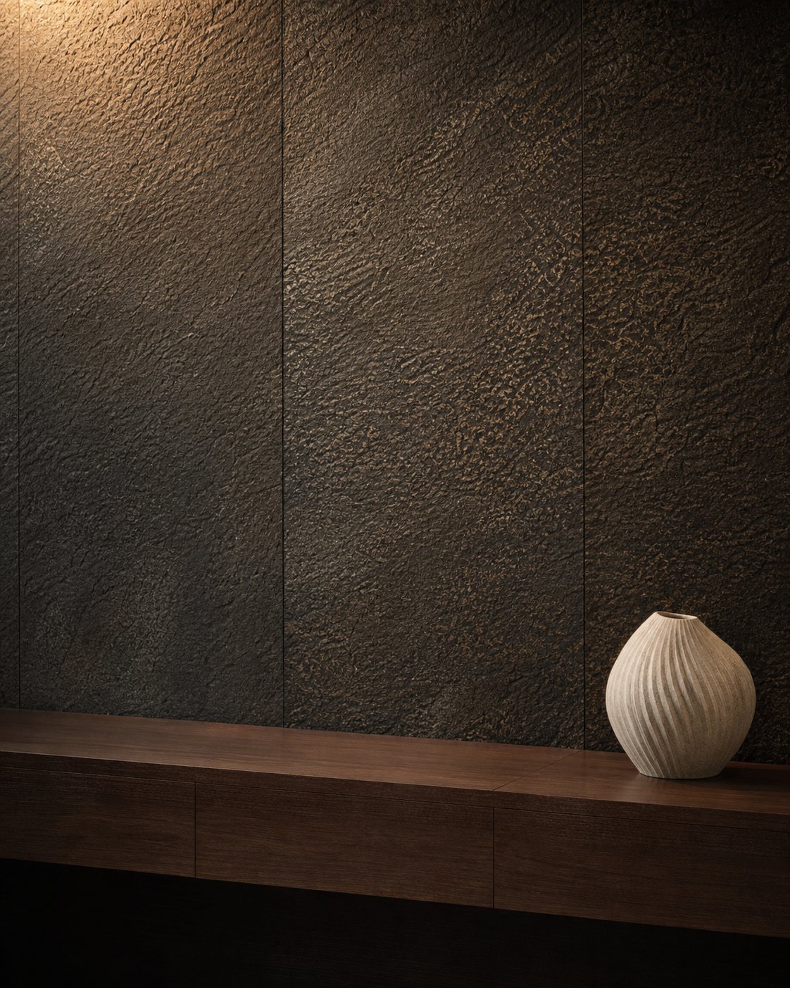Rich charcoal decorative wall surface with a tactile bronze-toned texture